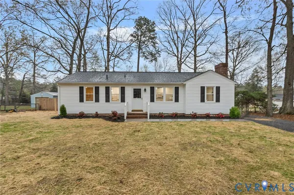 a house that has a tree in front of it