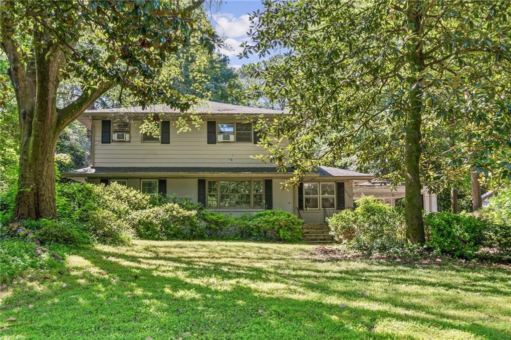 2839 Orion Drive Decatur, GA 30033 - Photo 1 of 1 a front view of a house with a garden
