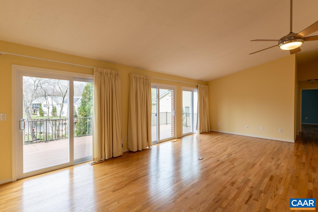 938 Jefferson Drive Palmyra, VA 22963 - Photo 16 of 50 a view of an empty room with wooden floor and a window