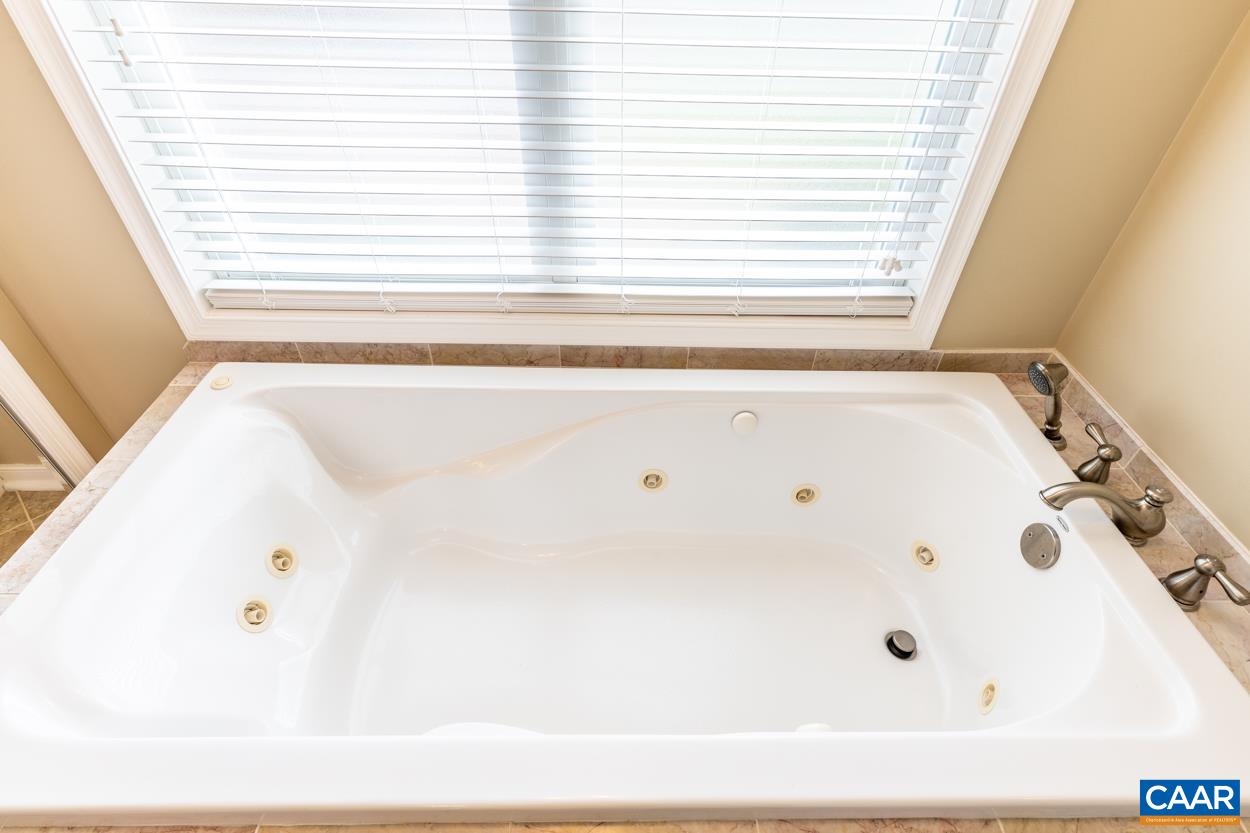 938 Jefferson Drive Palmyra, VA 22963 - Photo 22 of 50 a bathroom with a bathtub and a window