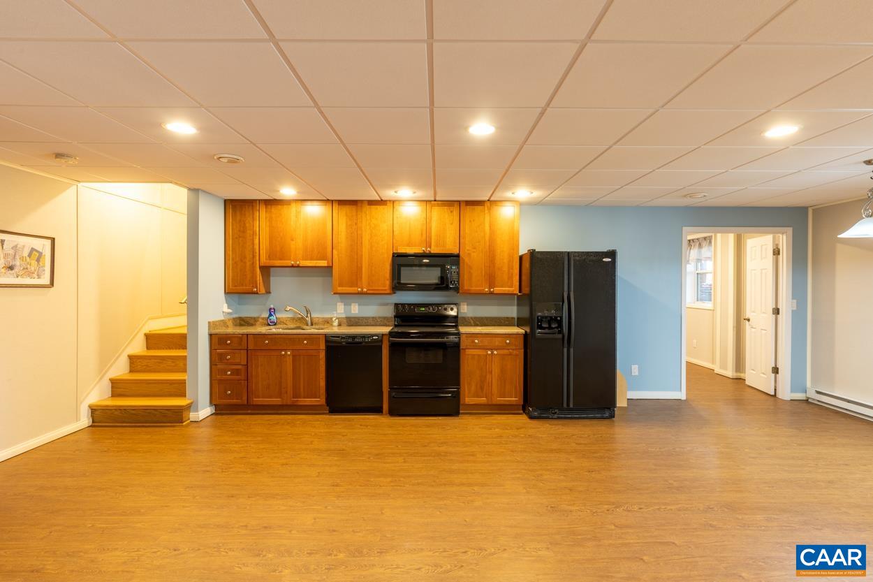 938 Jefferson Drive Palmyra, VA 22963 - Photo 32 of 50 a view of a kitchen with refrigerator and chairs