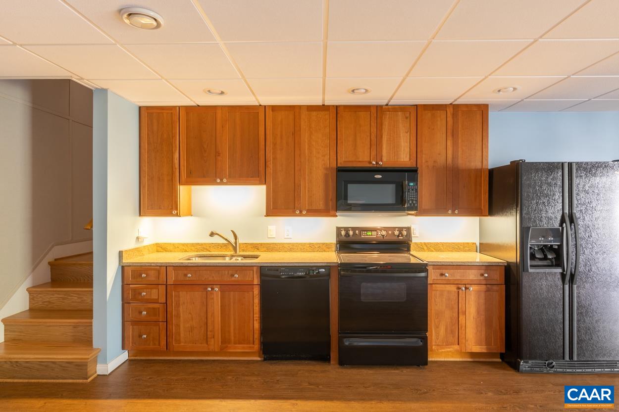 938 Jefferson Drive Palmyra, VA 22963 - Photo 35 of 50 a kitchen with stainless steel appliances granite countertop a stove a sink and a refrigerator