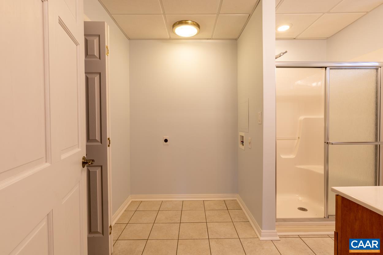 938 Jefferson Drive Palmyra, VA 22963 - Photo 39 of 50 a bathroom with a shower and a glass door