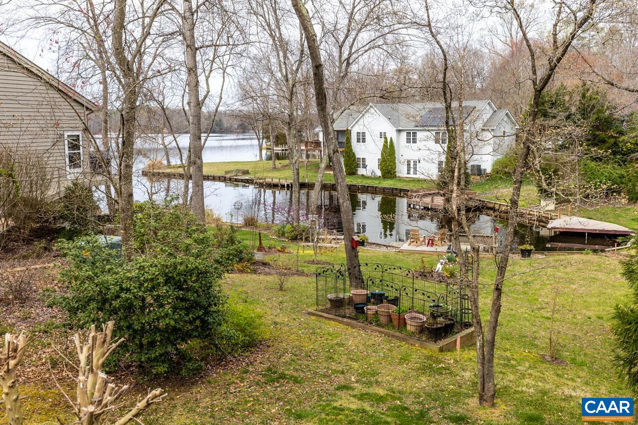 938 Jefferson Drive Palmyra, VA 22963 - Photo 4 of 50 a view of swimming pool with outdoor seating and trees in the background