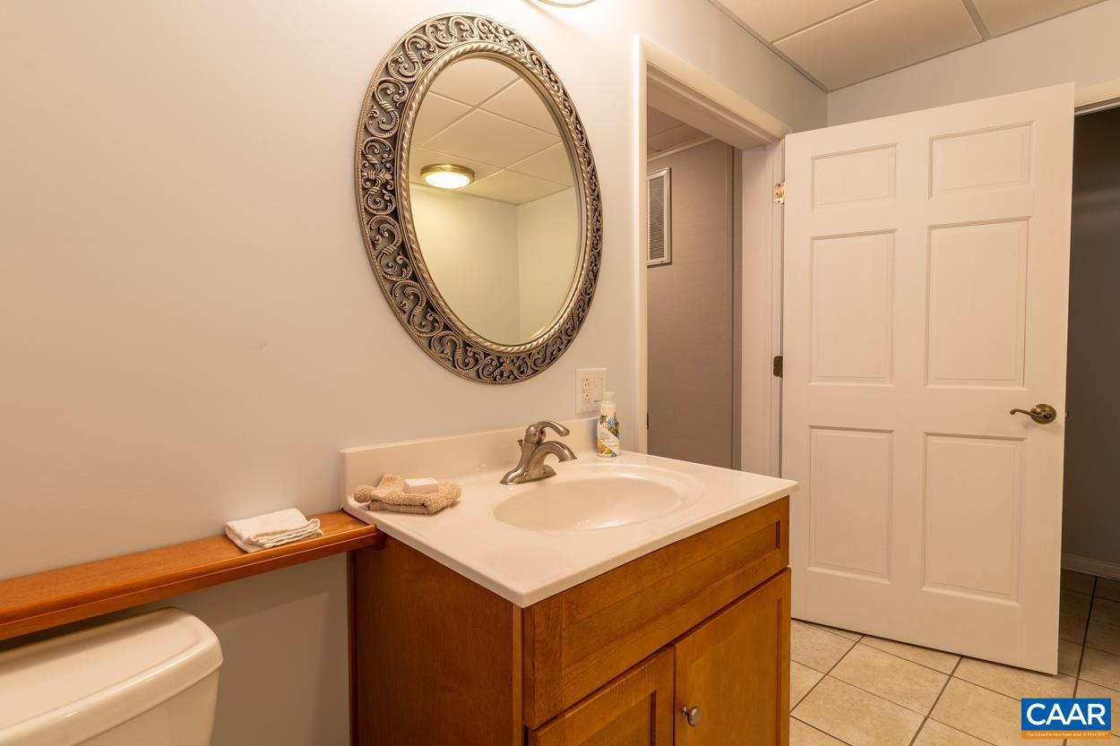 938 Jefferson Drive Palmyra, VA 22963 - Photo 41 of 50 a bathroom with a sink and a mirror