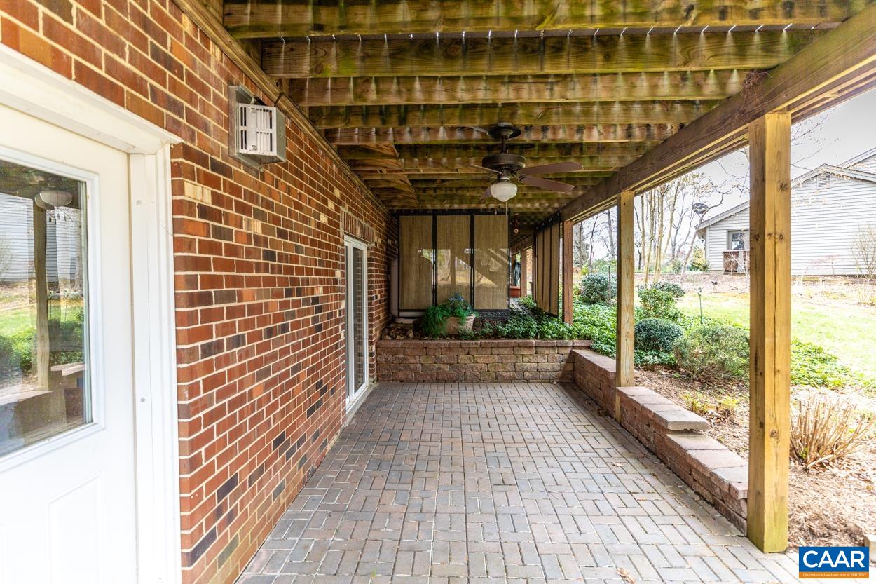 938 Jefferson Drive Palmyra, VA 22963 - Photo 49 of 50 a view of a porch with wooden floor and iron stairs