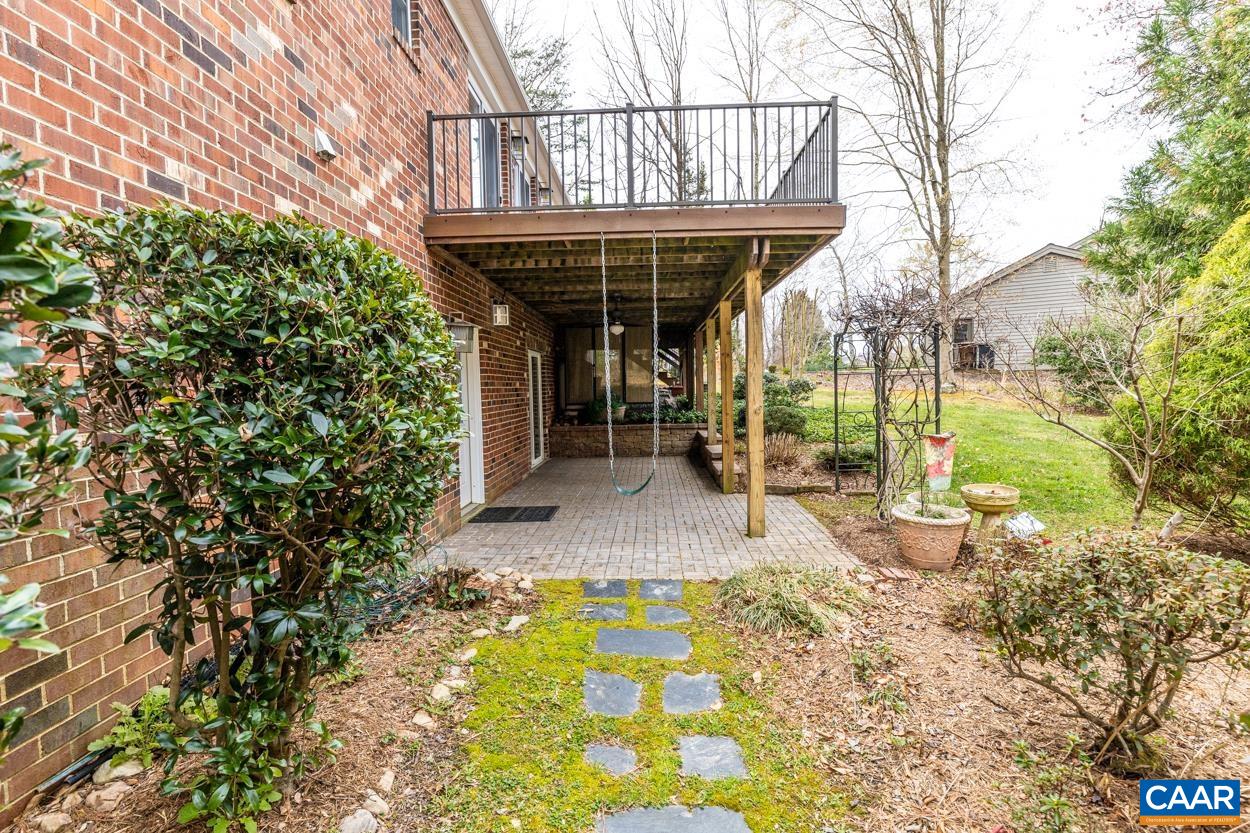 938 Jefferson Drive Palmyra, VA 22963 - Photo 50 of 50 a view of a patio with table and chairs and potted plants