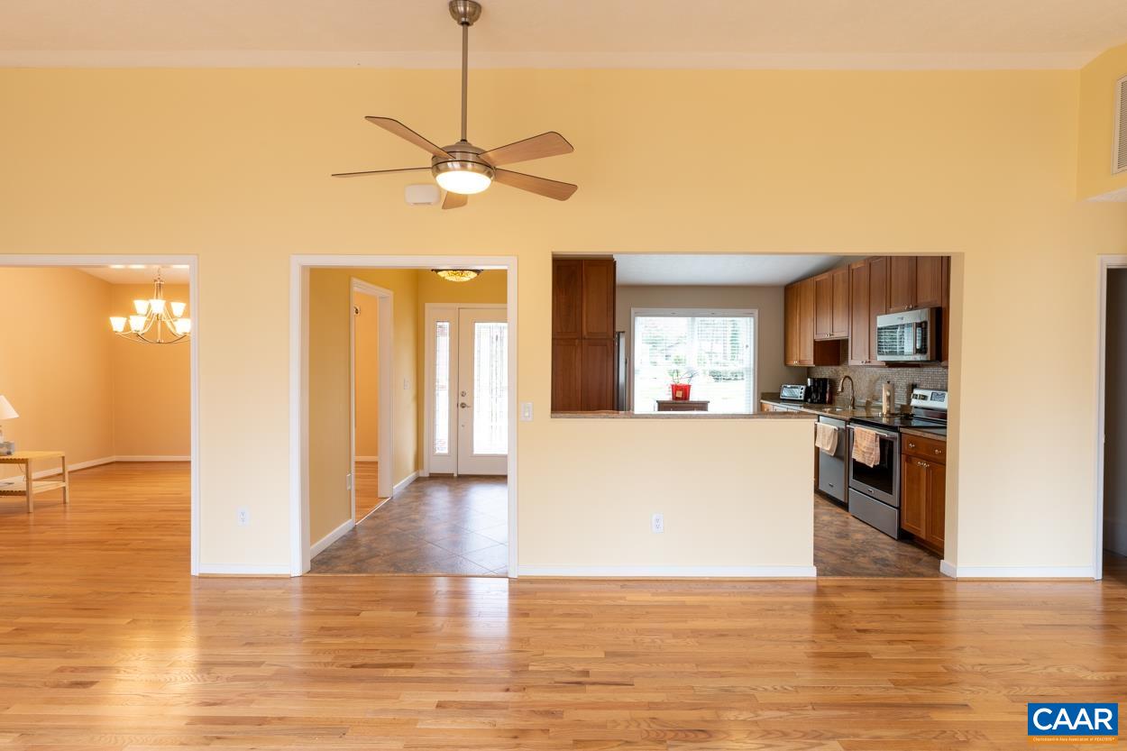 938 Jefferson Drive Palmyra, VA 22963 - Photo 7 of 50 a view of a kitchen with kitchen island stainless steel appliances a sink cabinets and wooden floor