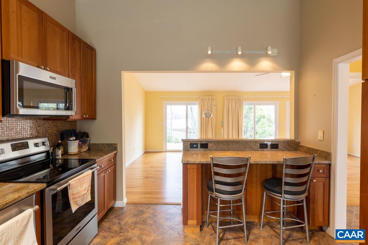 938 Jefferson Drive Palmyra, VA 22963 - Photo 9 of 50 a kitchen with a stove a sink and a microwave