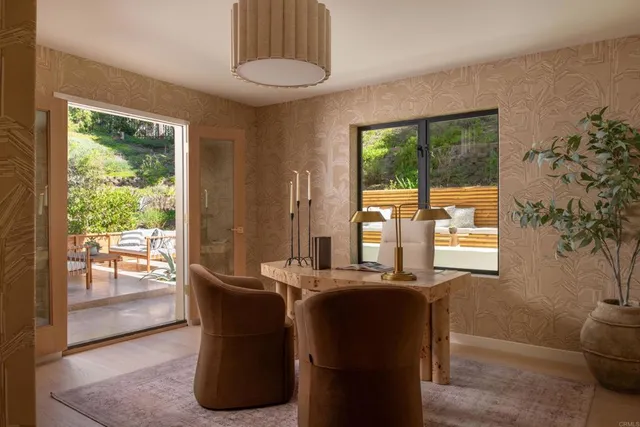 a dining room with furniture and windows