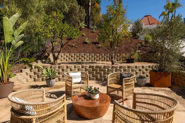 a table and chairs sitting on a patio