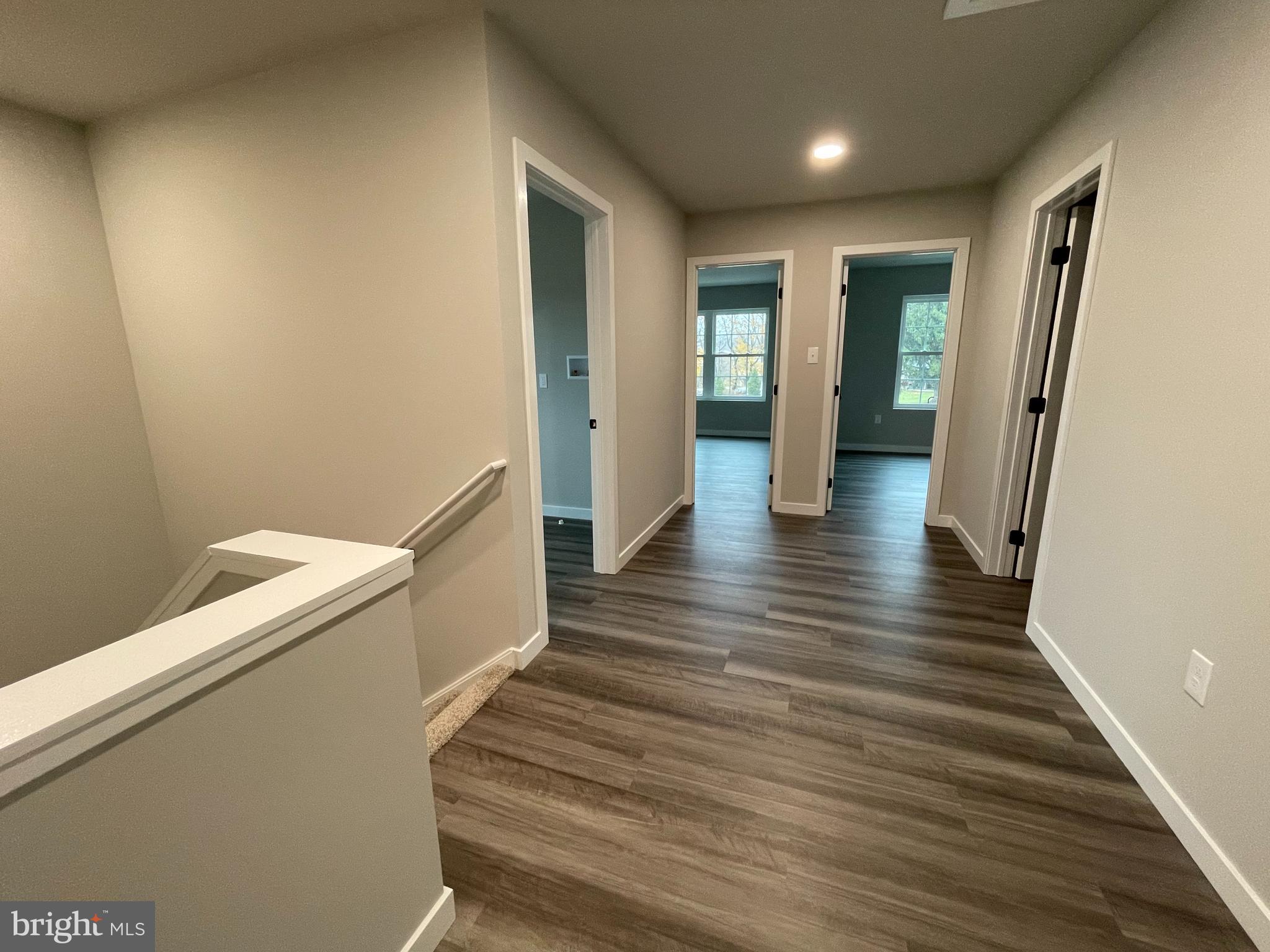 6173 Rizzuto Way Coopersburg, PA 18036 - Photo 11 of 21 a view of a hallway with wooden floor