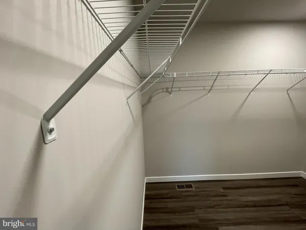 a view of a room with racks on the wall
