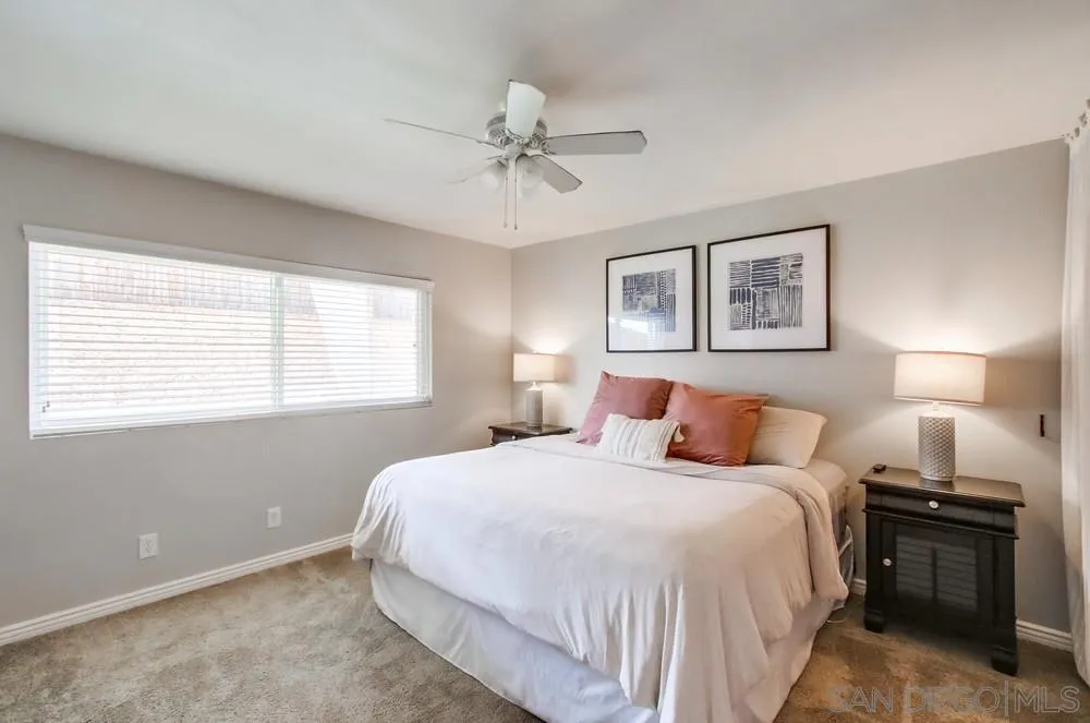9118 Gotta Place Lakeside, CA 92040 - Photo 29 of 50 a bedroom with a bed and a chandelier