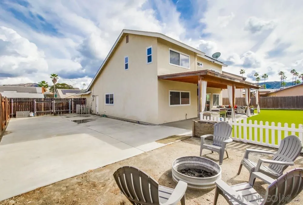 9118 Gotta Place Lakeside, CA 92040 - Photo 40 of 50 a front view of a house with swimming pool table and chairs