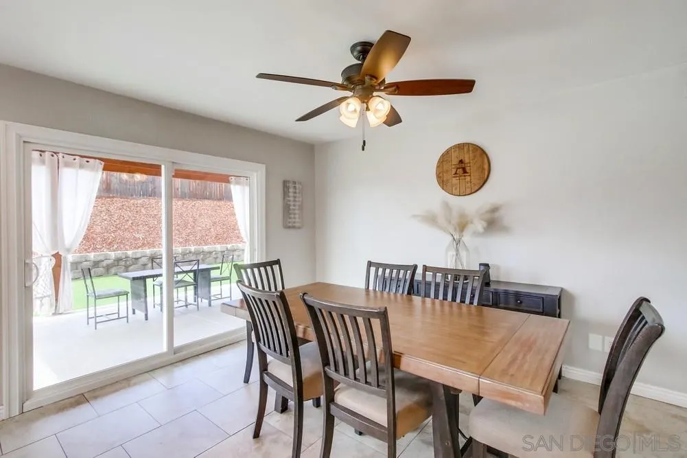 9118 Gotta Place Lakeside, CA 92040 - Photo 9 of 50 a view of a dining room with furniture window and wooden floor