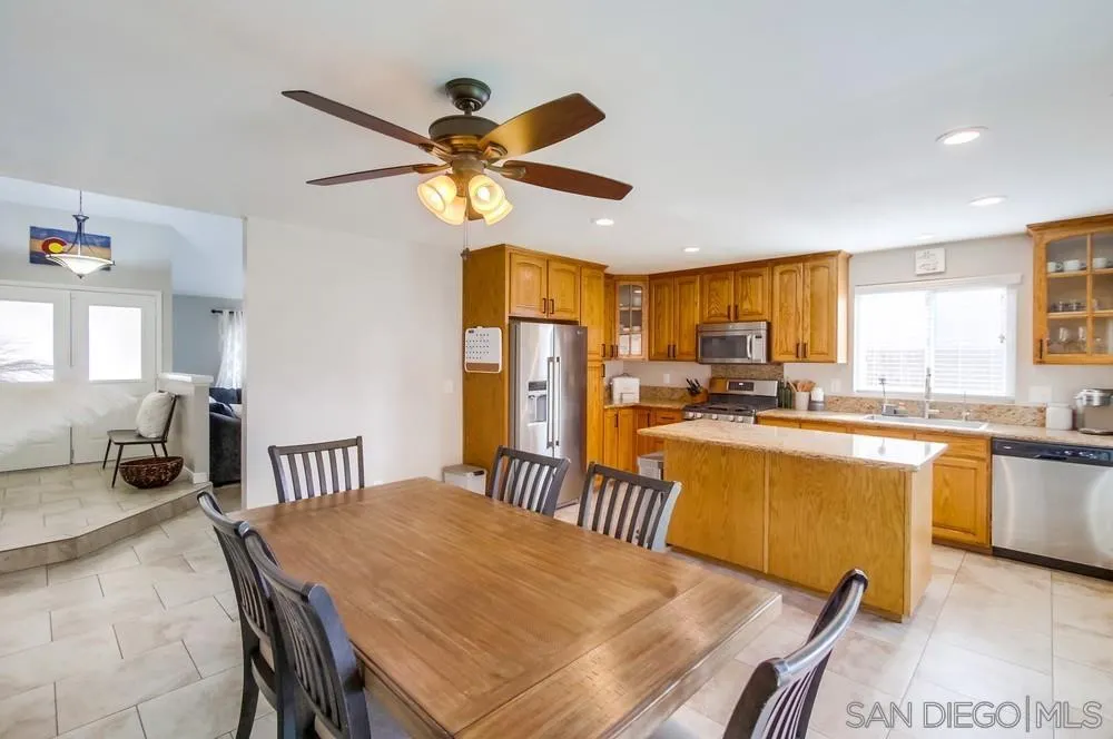 9118 Gotta Place Lakeside, CA 92040 - Photo 10 of 50 a view of a dining room with furniture window and wooden floor