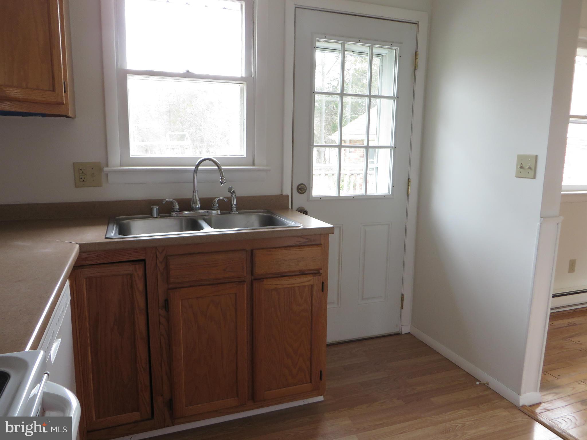 4101 Baptist Road Taneytown, MD 21787 - Photo 13 of 30 a bathroom with a granite countertop sink a window and a mirror