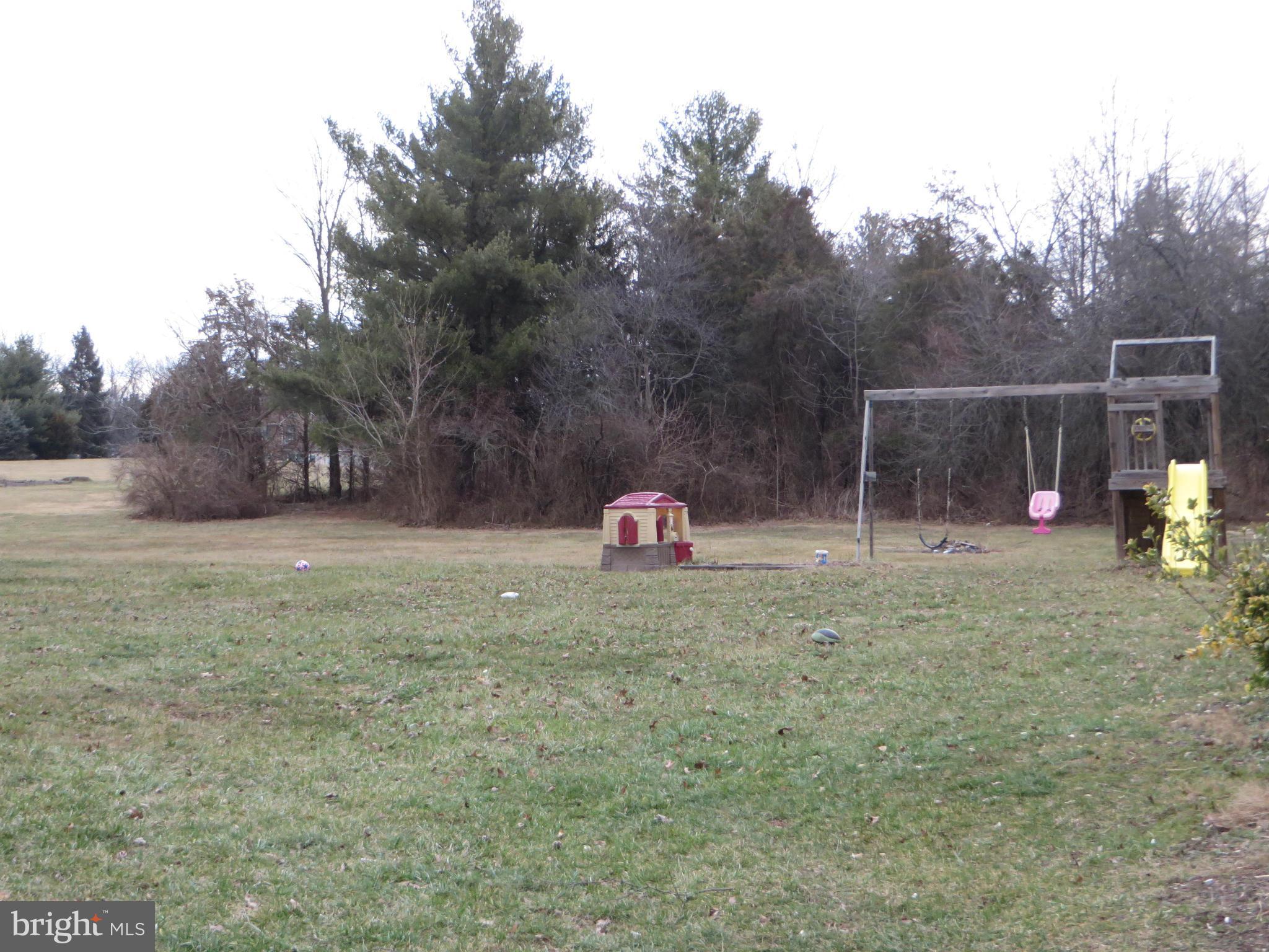 4101 Baptist Road Taneytown, MD 21787 - Photo 6 of 30 a backyard of a house with portable swimming pool and basket ball court