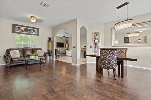 a living room with furniture and a table