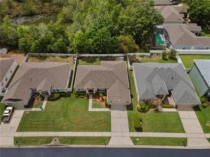 an aerial view of lake residential houses with outdoor space and lake view