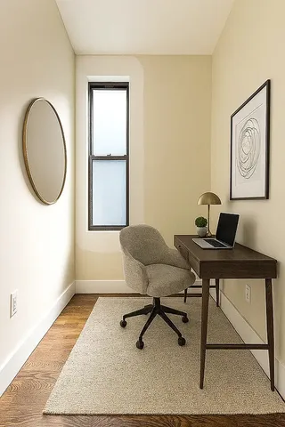 a work room with furniture and a window