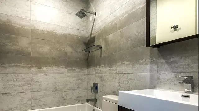 a bathroom with a sink and shower