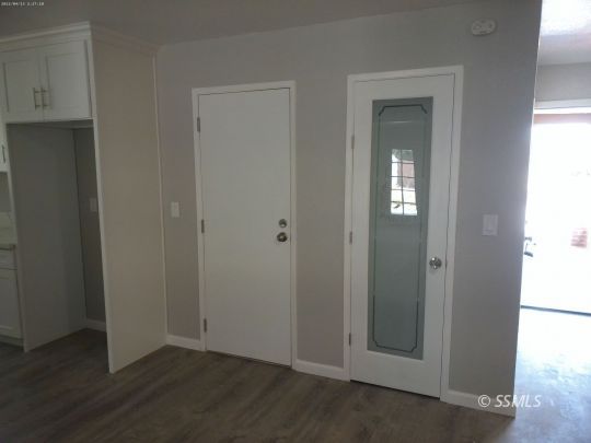 209 South Fire Opal Street Ridgecrest, CA 93555 - Photo 5 of 23 an empty room with windows