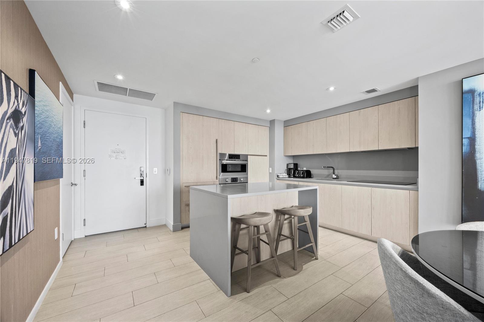 4010 South Ocean Drive, Unit R2307 Hollywood, FL 33019 - Photo 13 of 35 a kitchen with a sink cabinets and stainless steel appliances