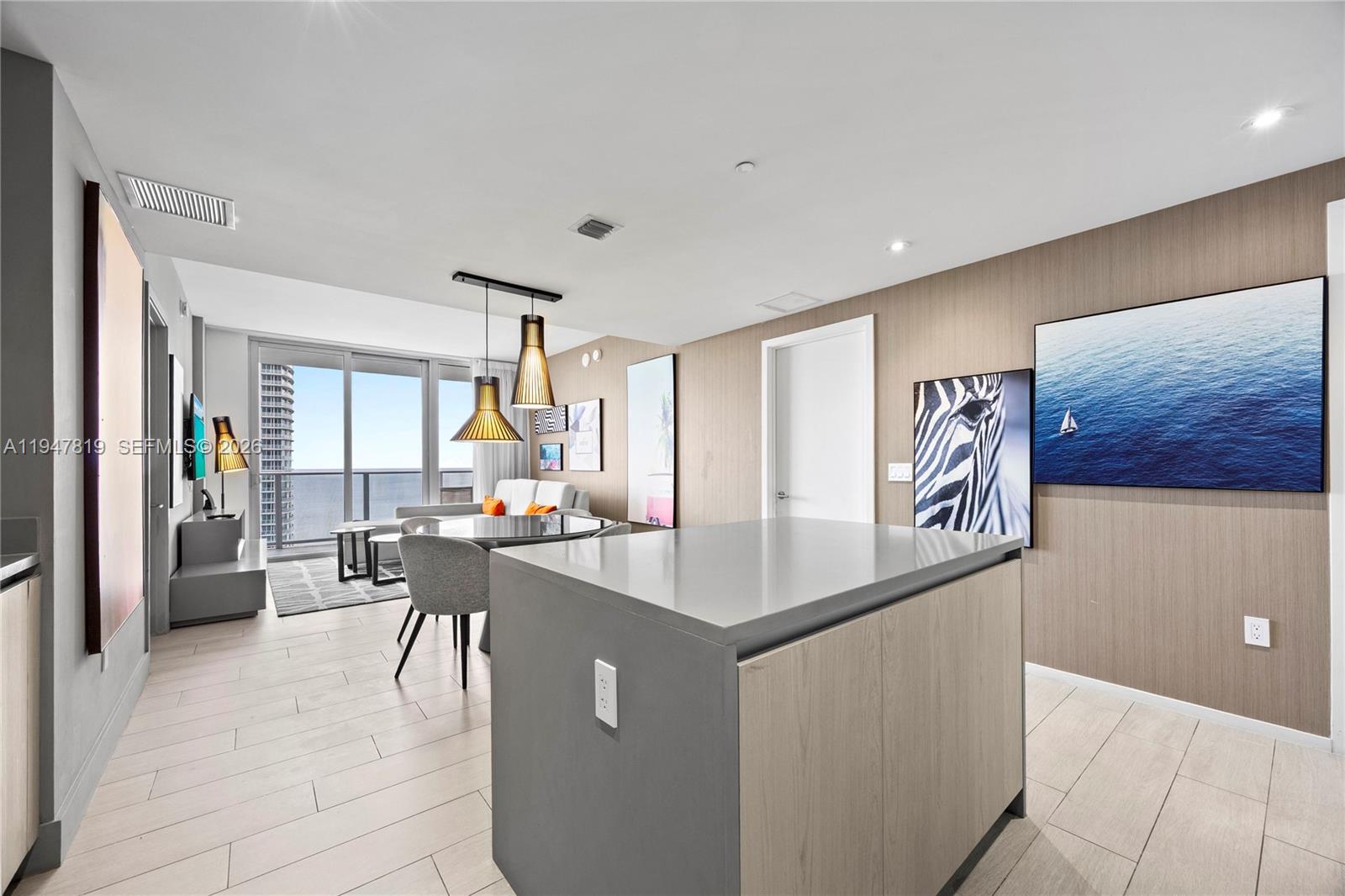 4010 South Ocean Drive, Unit R2307 Hollywood, FL 33019 - Photo 14 of 35 a view of a dining room with furniture window and outside view