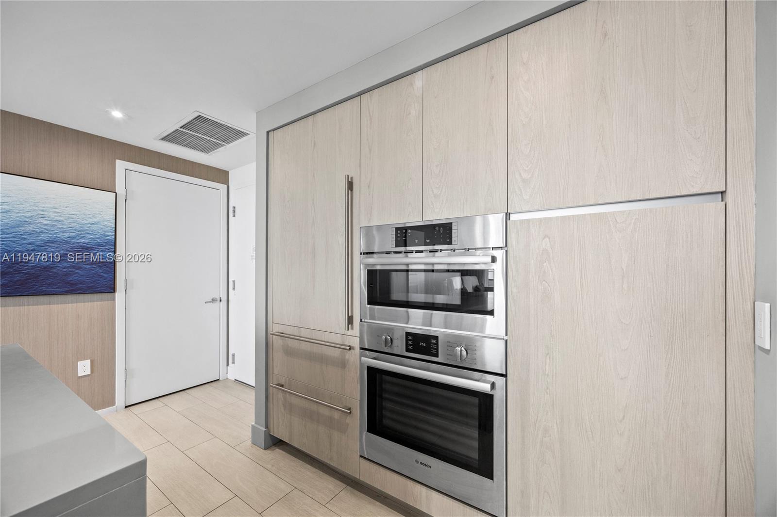 4010 South Ocean Drive, Unit R2307 Hollywood, FL 33019 - Photo 16 of 35 a kitchen with stainless steel appliances a refrigerator sink and microwave