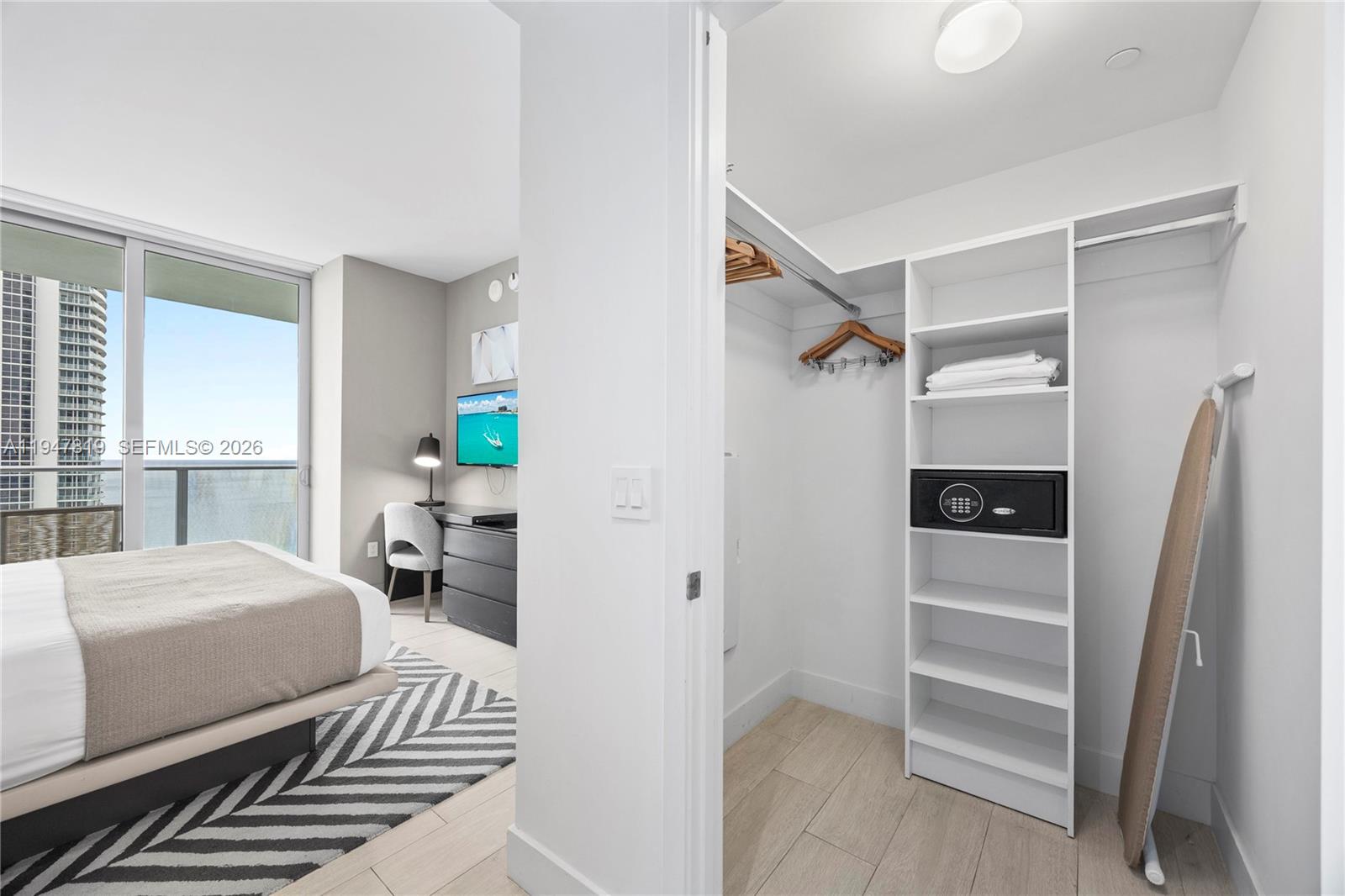 4010 South Ocean Drive, Unit R2307 Hollywood, FL 33019 - Photo 18 of 35 a bedroom with a bed and a window