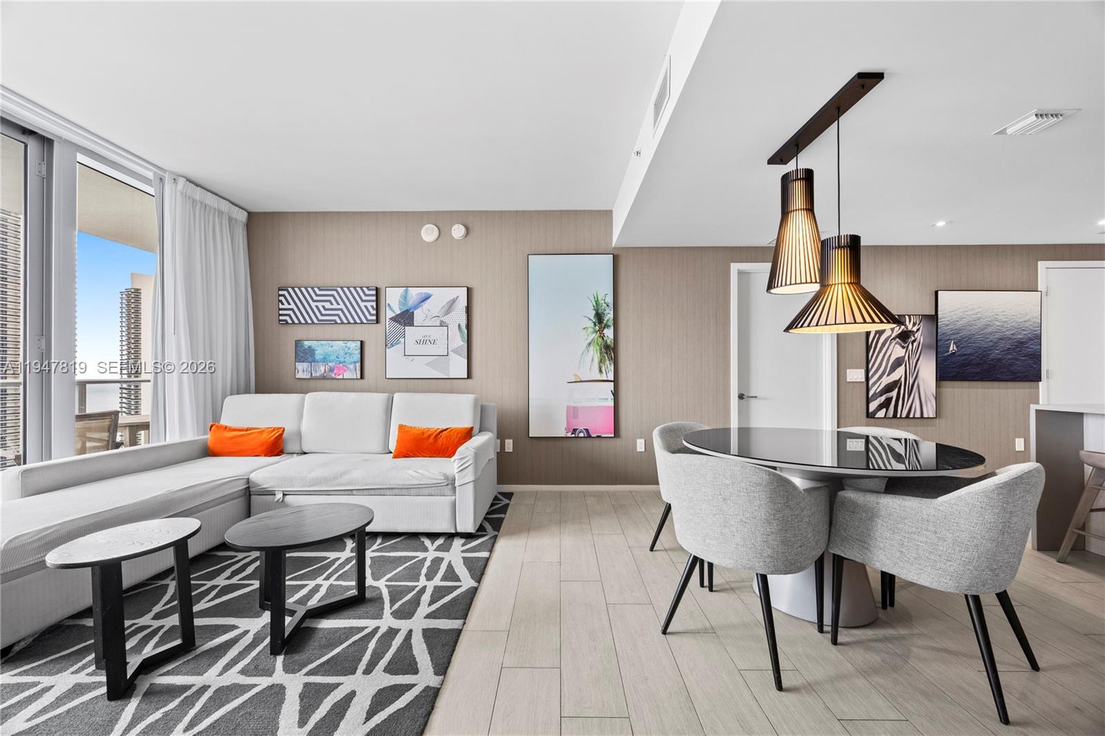 4010 South Ocean Drive, Unit R2307 Hollywood, FL 33019 - Photo 2 of 35 a living room with furniture and a wooden floor