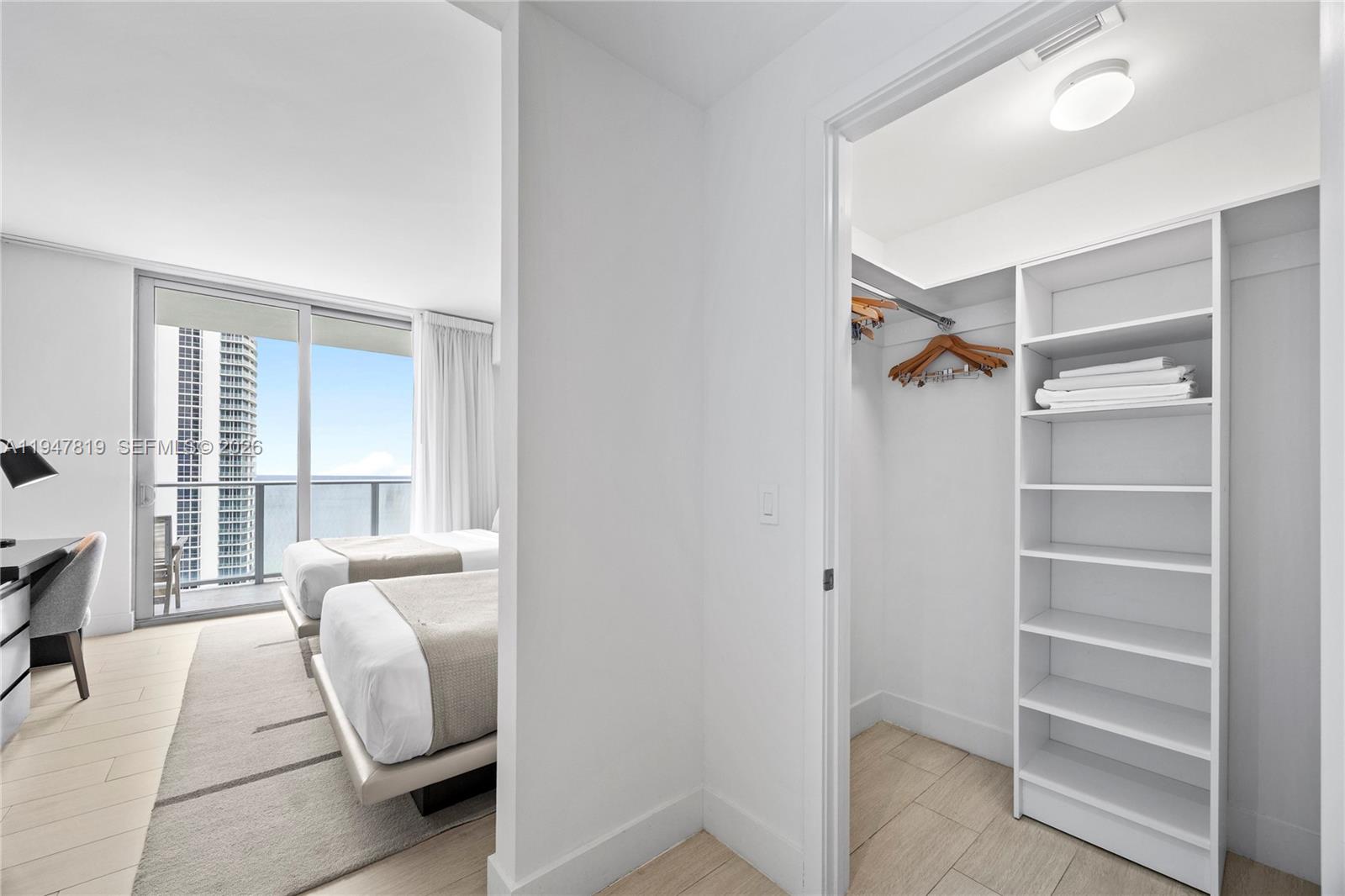 4010 South Ocean Drive, Unit R2307 Hollywood, FL 33019 - Photo 25 of 35 a living room with furniture and a window