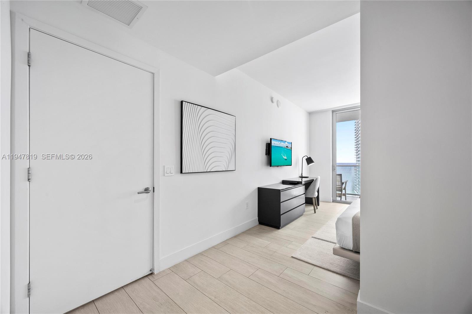 4010 South Ocean Drive, Unit R2307 Hollywood, FL 33019 - Photo 27 of 35 a view of living room with furniture and wooden floor