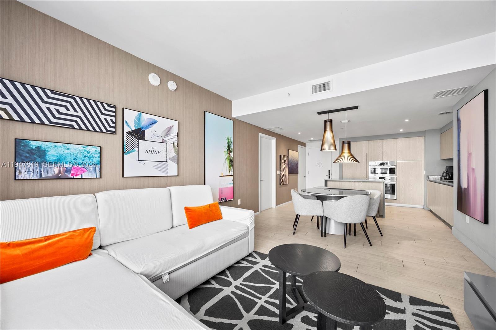 4010 South Ocean Drive, Unit R2307 Hollywood, FL 33019 - Photo 3 of 35 a living room with furniture and wooden floor