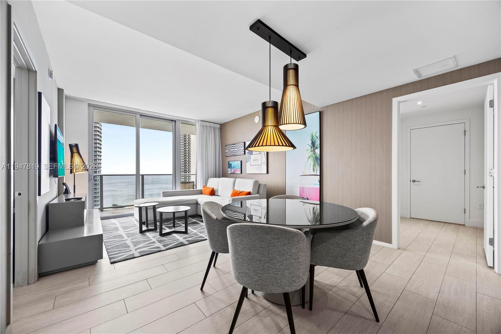 4010 South Ocean Drive, Unit R2307 Hollywood, FL 33019 - Photo 4 of 35 a living room with fireplace furniture and a large window