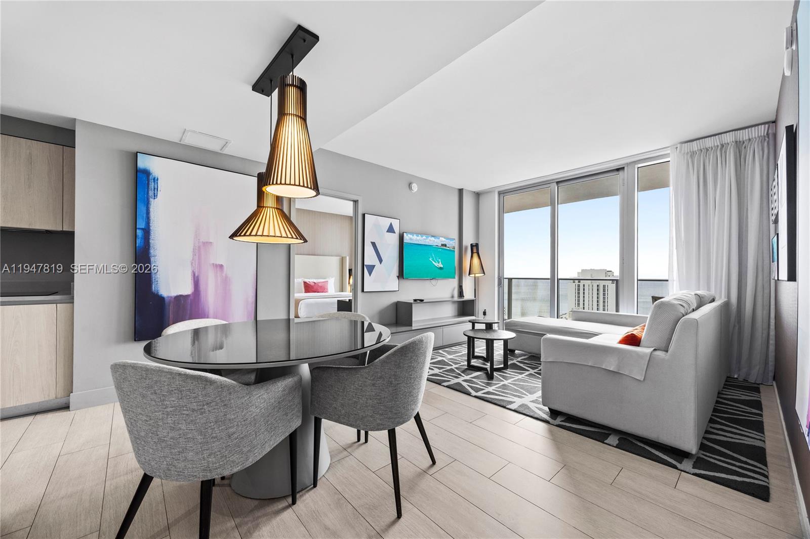 4010 South Ocean Drive, Unit R2307 Hollywood, FL 33019 - Photo 6 of 35 a living room with fireplace furniture and a large window