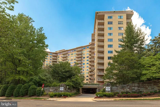 a front view of a building with a yard