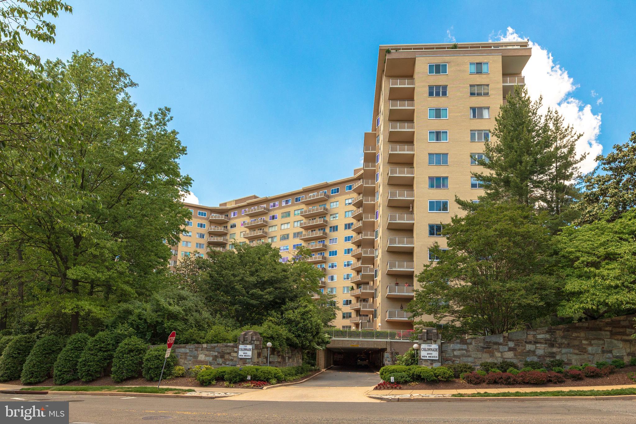a front view of a building with a yard