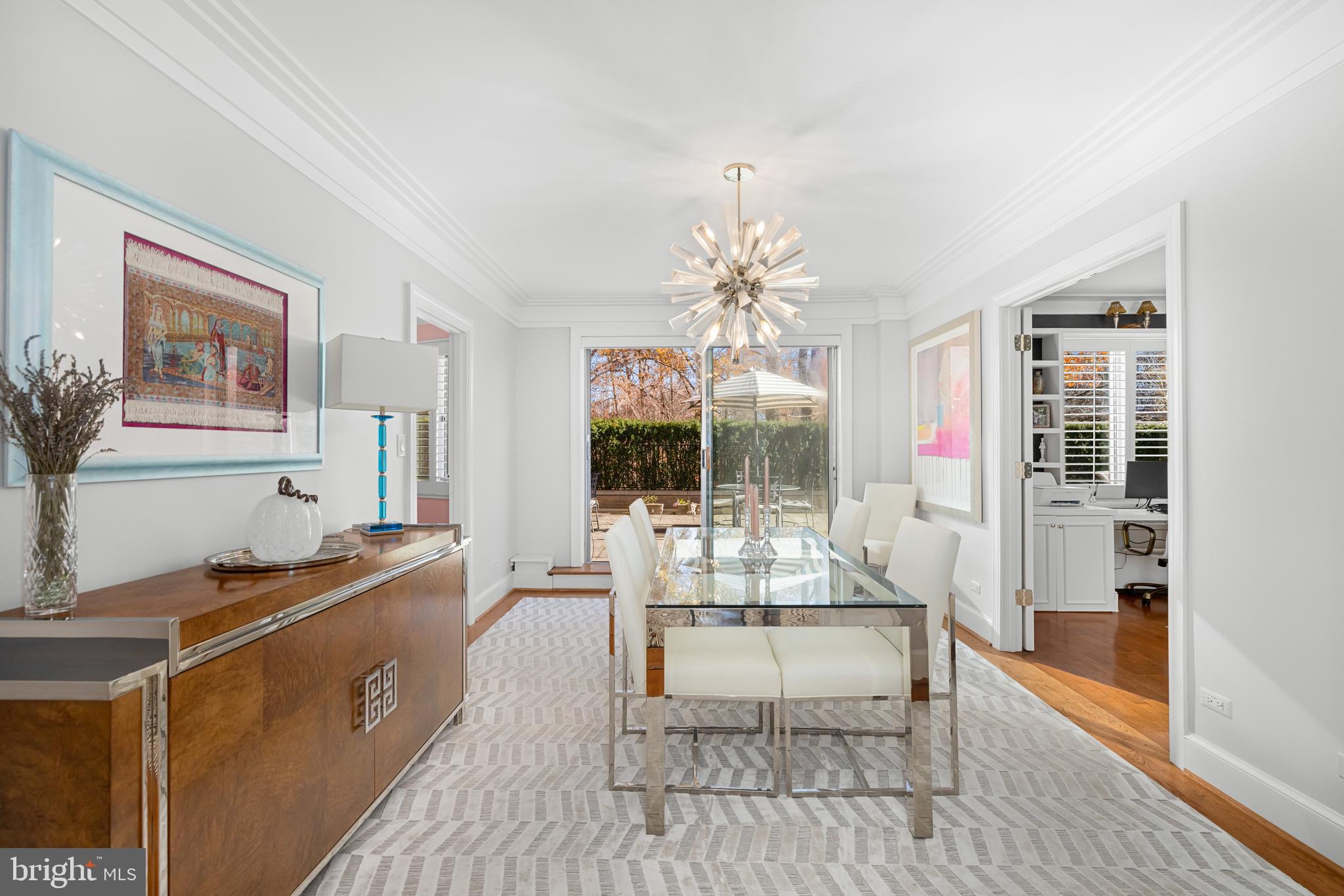 2801 New Mexico Avenue Northwest, Unit 204 Washington, DC 20007 - Photo 11 of 49 a living room with furniture and a chandelier