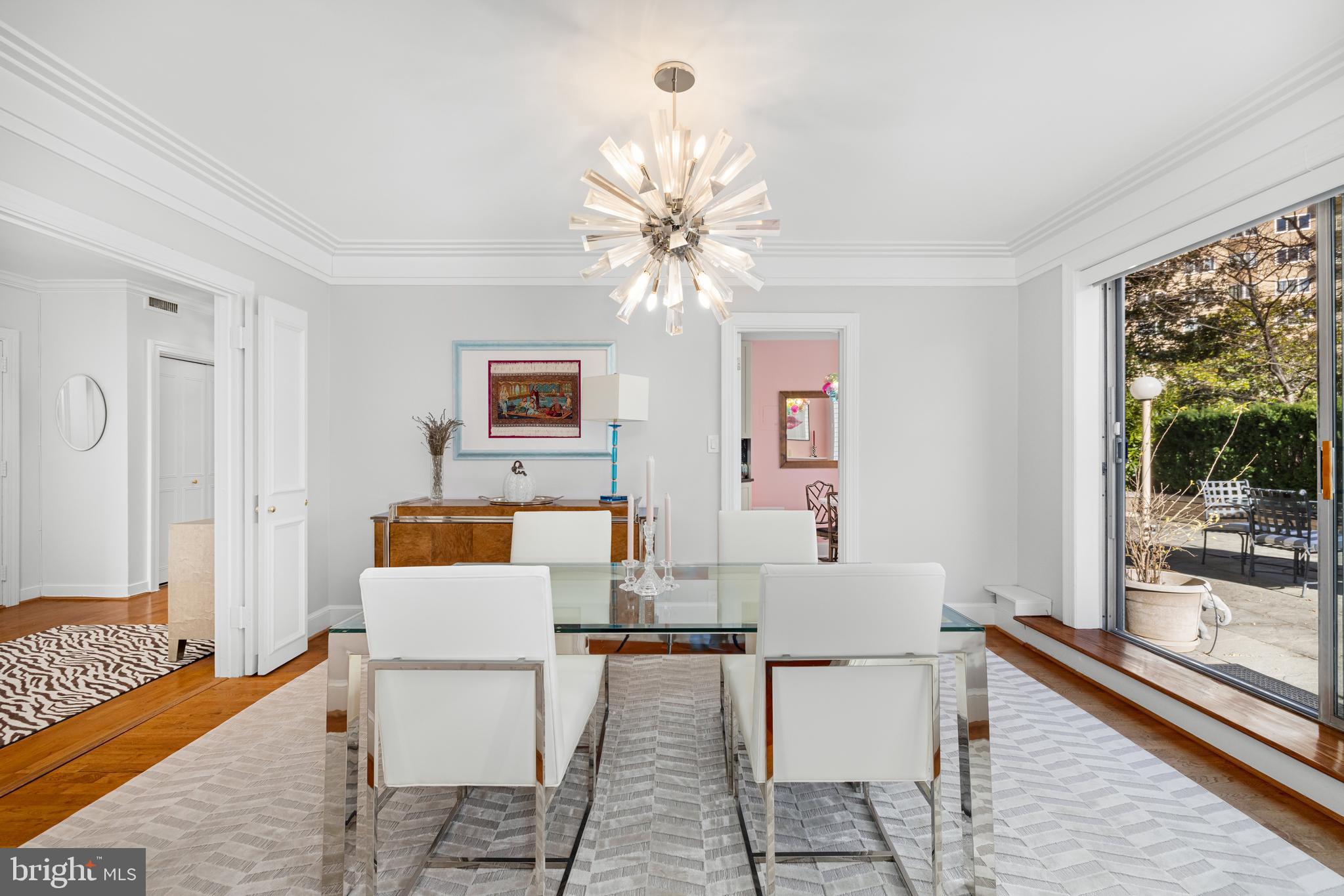 2801 New Mexico Avenue Northwest, Unit 204 Washington, DC 20007 - Photo 12 of 49 a living room with fireplace furniture and a large window