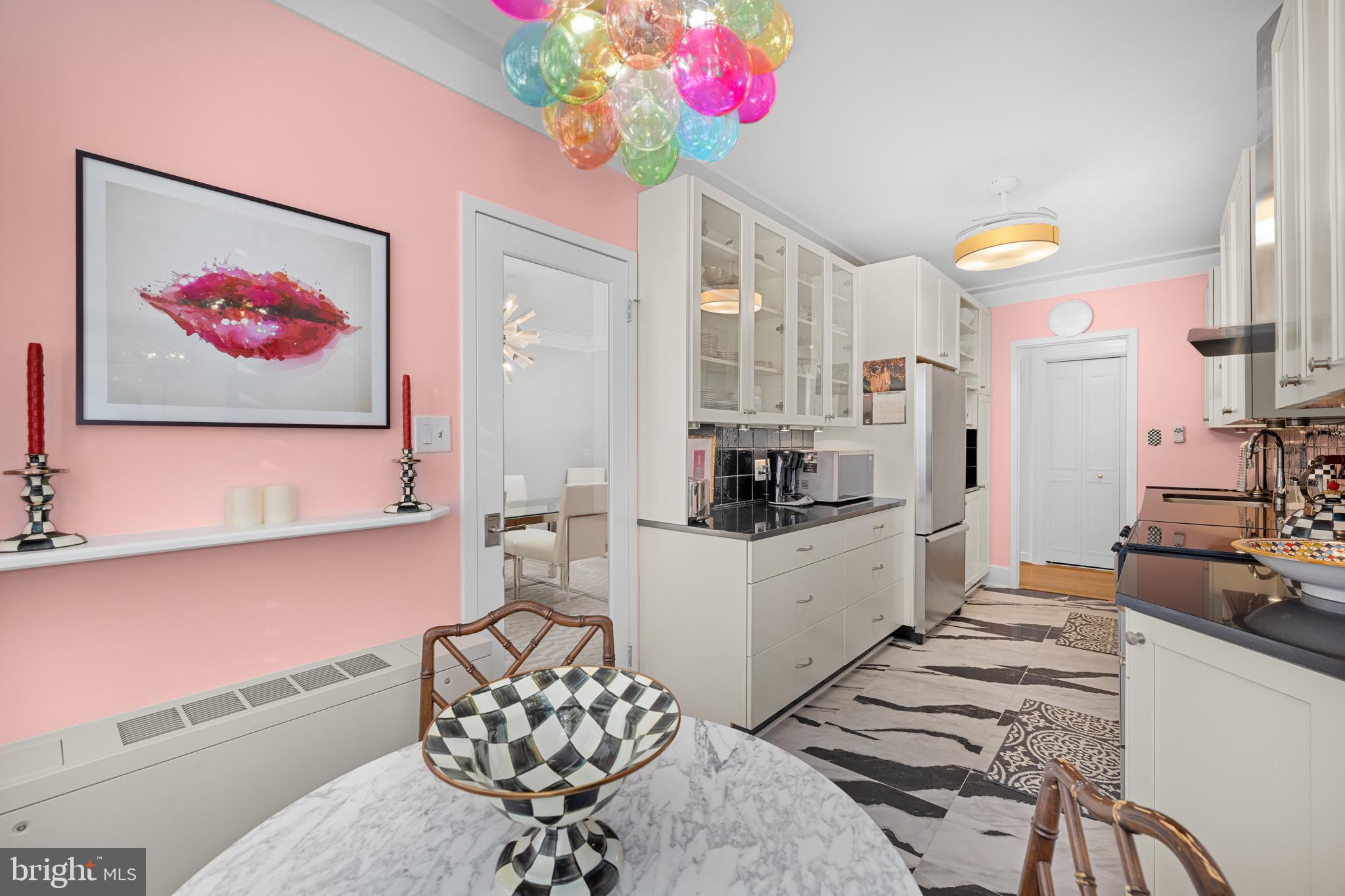 2801 New Mexico Avenue Northwest, Unit 204 Washington, DC 20007 - Photo 15 of 49 a kitchen with stainless steel appliances kitchen island granite countertop a sink and cabinets