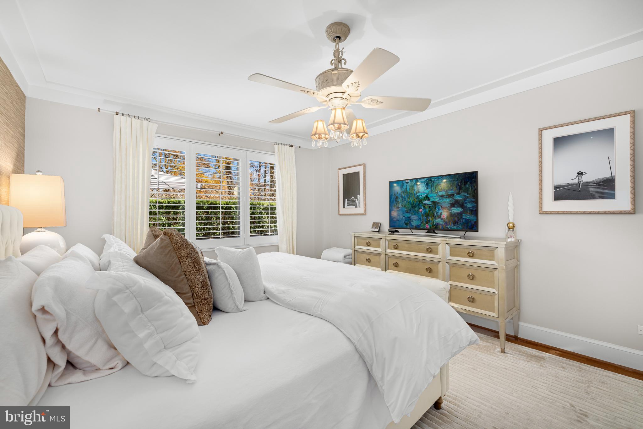 2801 New Mexico Avenue Northwest, Unit 204 Washington, DC 20007 - Photo 19 of 49 a bedroom with a bed and a flat screen tv