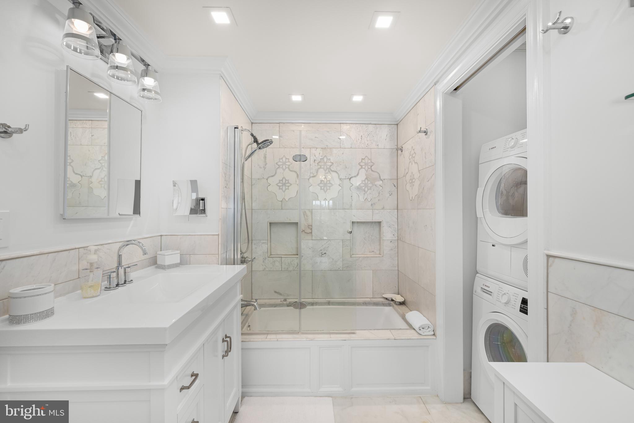 2801 New Mexico Avenue Northwest, Unit 204 Washington, DC 20007 - Photo 21 of 49 a bathroom with a bathtub shower sink vanity and toilet