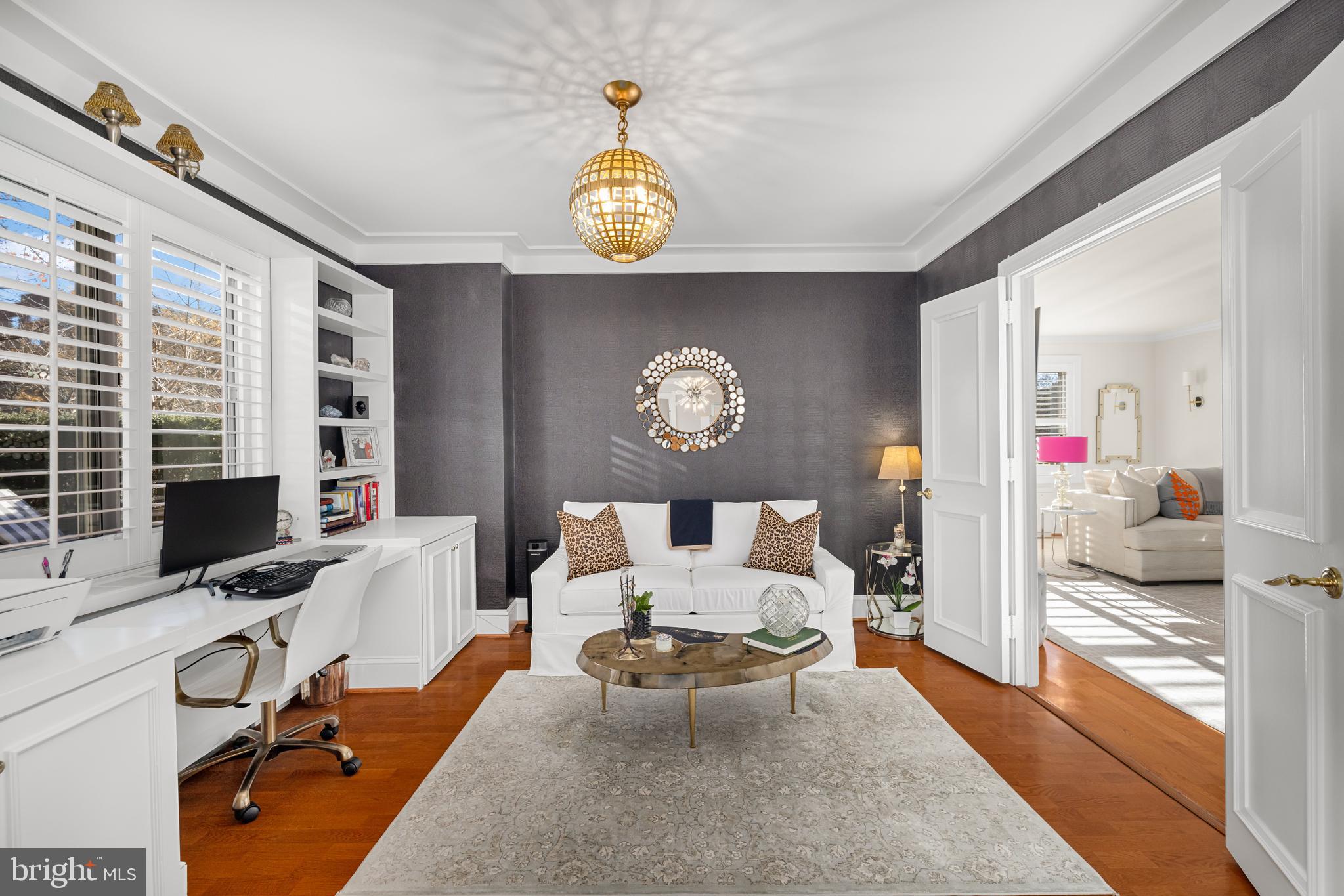 2801 New Mexico Avenue Northwest, Unit 204 Washington, DC 20007 - Photo 23 of 49 a living room with furniture a flat screen tv and a table