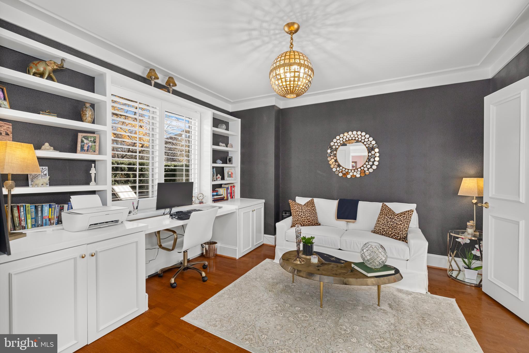 2801 New Mexico Avenue Northwest, Unit 204 Washington, DC 20007 - Photo 24 of 49 a living room with furniture and a large window
