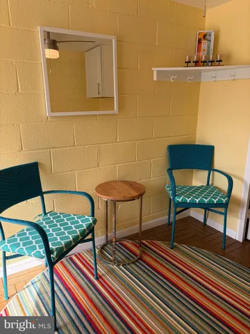 a bedroom with a bed and a television