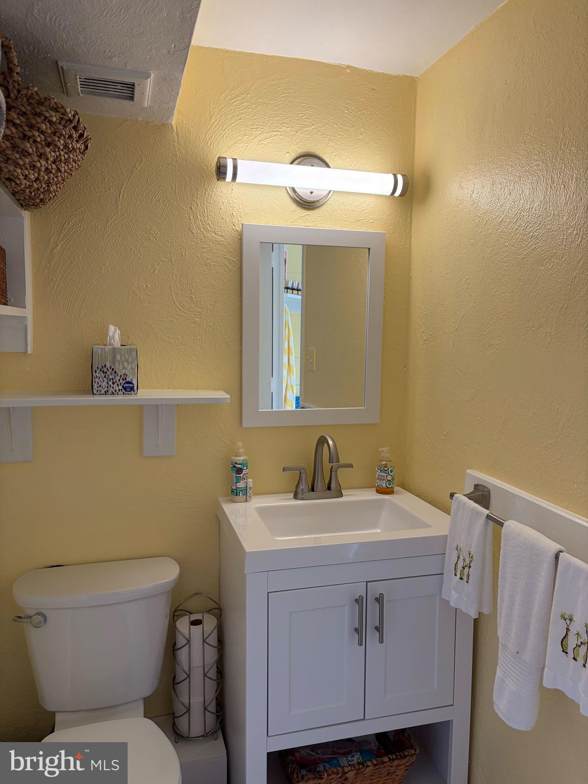 2801 New Mexico Avenue Northwest, Unit 204 Washington, DC 20007 - Photo 31 of 49 a bathroom with a sink toilet and mirror