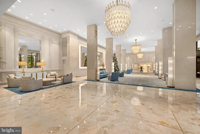 a view of a bathroom with a tub shower and mirror